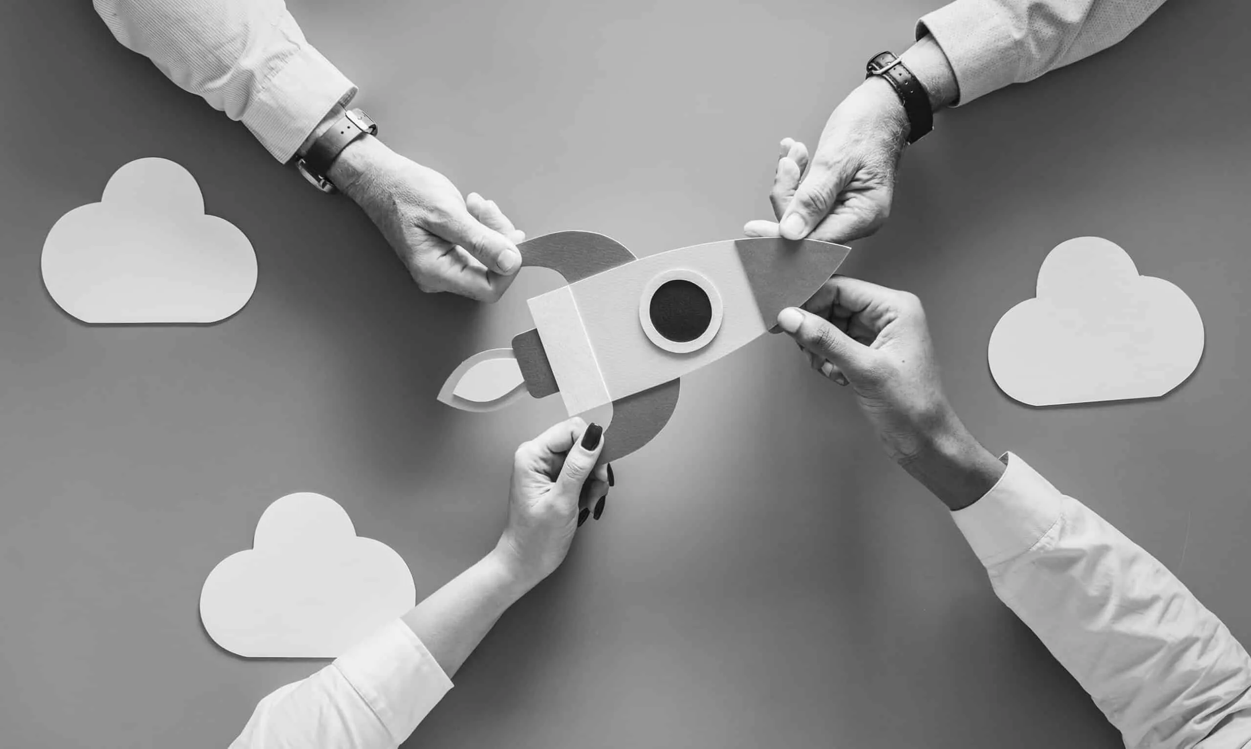 business-people-with-startup-rocket-scaled